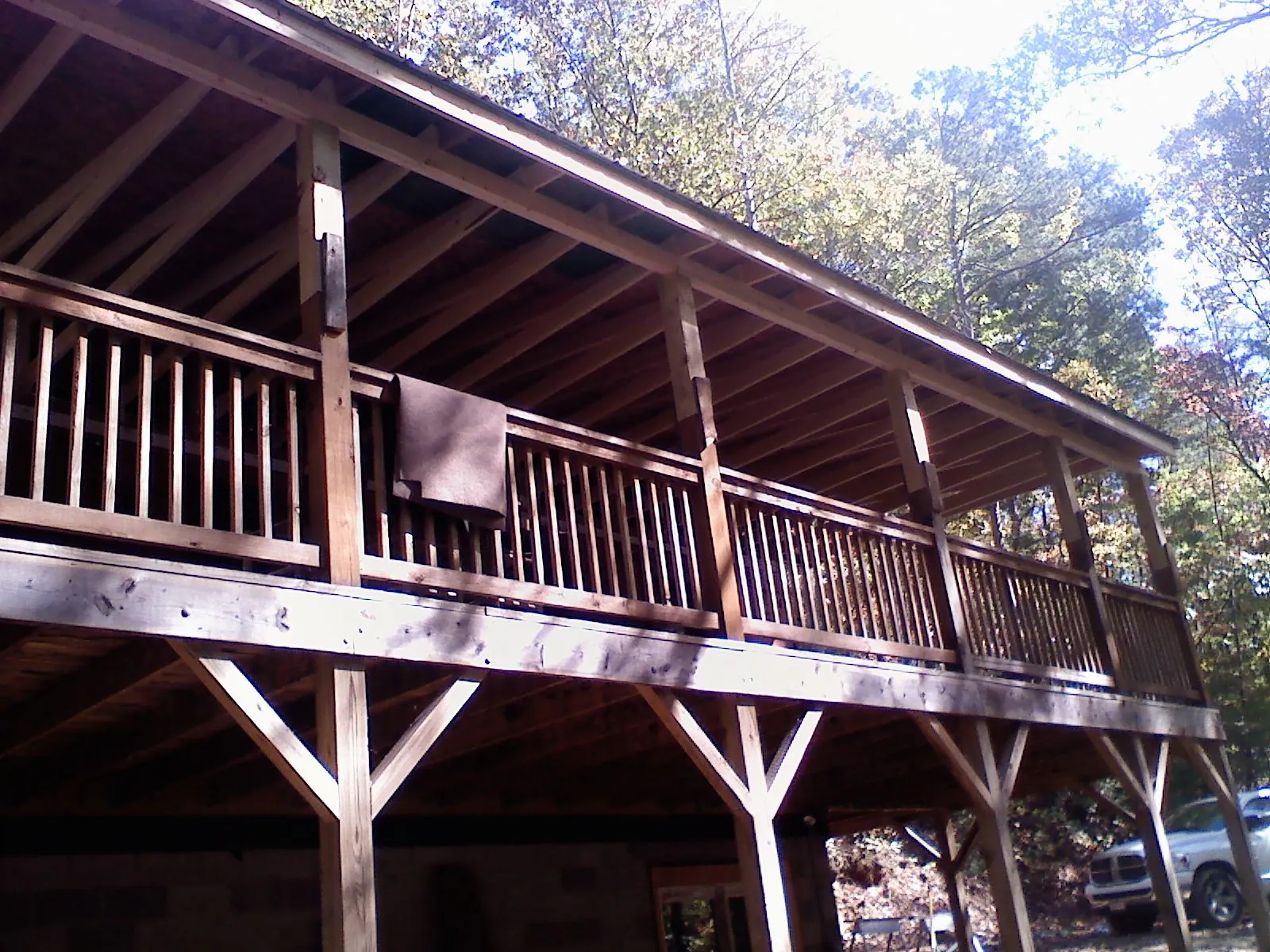 Timber framing under a new elevated porch and deck — Roof Leak Repair in North Chelmsford by Roofing Brothers
