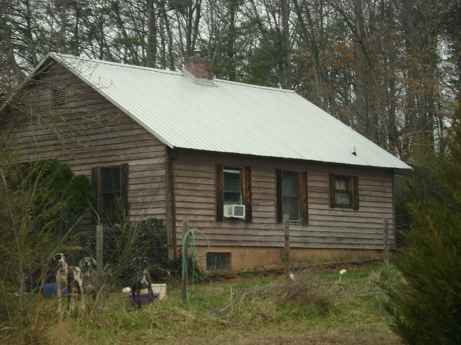 White metal roof on an old wood sided farmhouse, from a Metal Roof Installation job in North Chelmsford